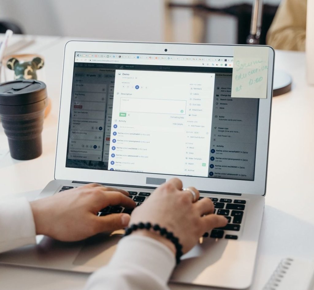 Marketer managing an email marketing inbox on a laptop