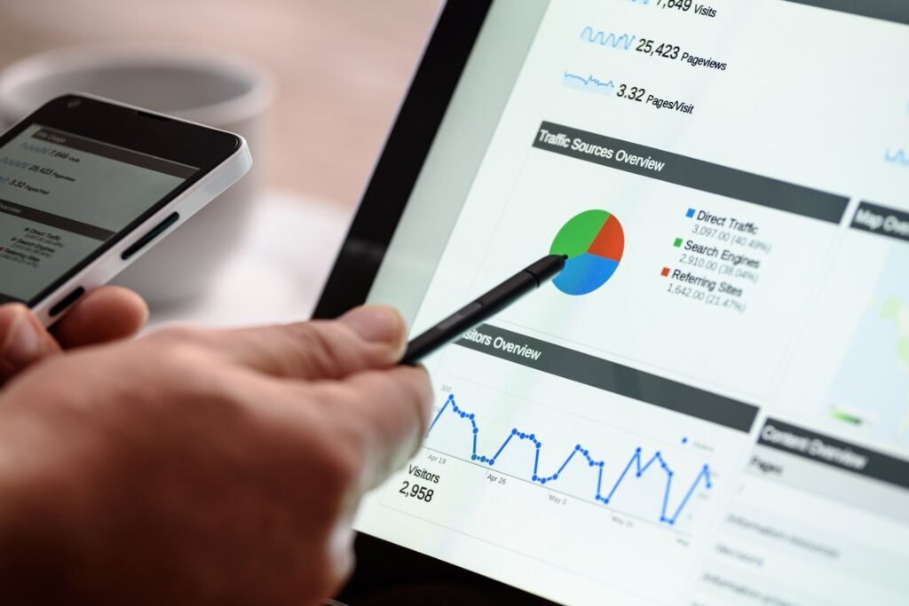Marketer reviewing website traffic analytics dashboard on a tablet